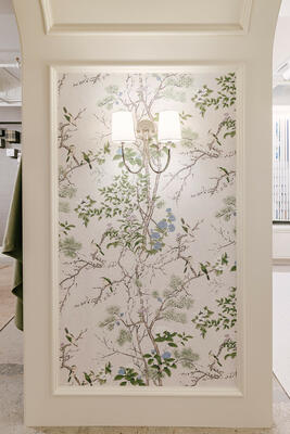 Katsura wallcovering in Cream and Lavender decorates the showroom arches