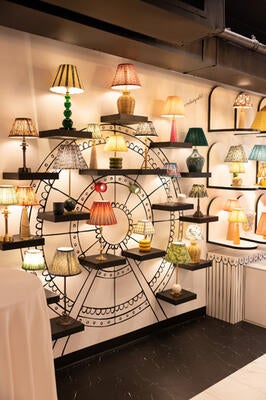 A wall full of lighting options cast the room in a lambent glow